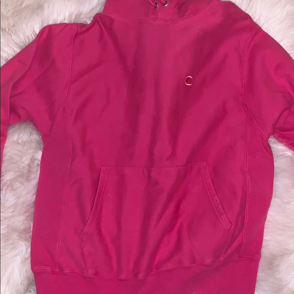 a medium pink champion hoodie